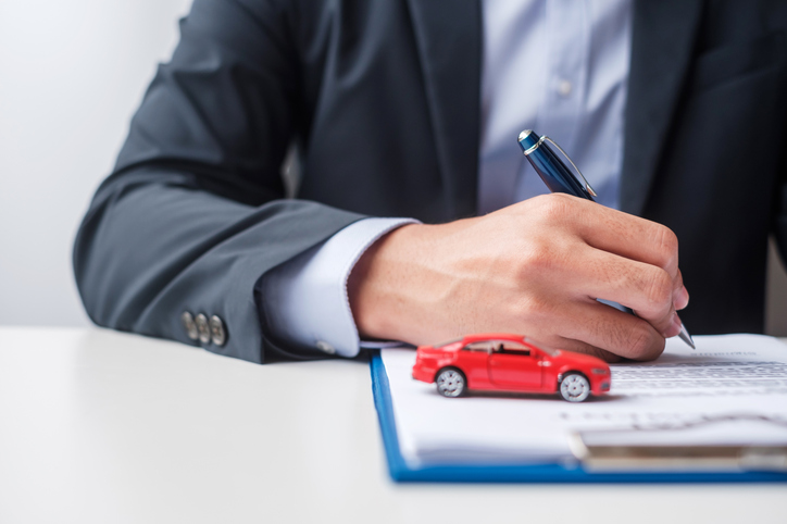 Businessman signing contract document. Rental contract, insurance, and contract agreement concepts